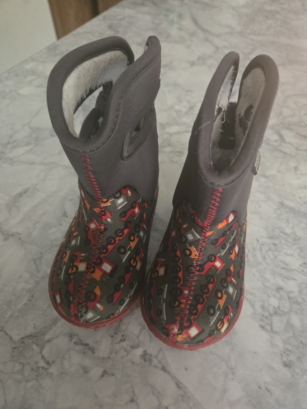 Bogs Kids Black Boots with Red and Orange Tractor Pattern